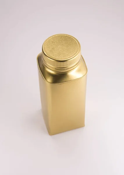 Gold plastic bottle — Stock Photo, Image