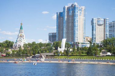 Volga river embankment in Samara, Russia. Panoramic view of the city. On a Sunny summer day. 18 June 2018 clipart