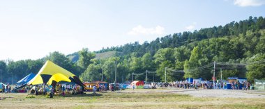 Grushinskiy festival on Mastrokosta lakes in the Samara region. Summer Sunny day, August 11, 2018 clipart