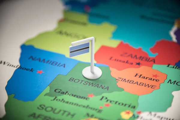 Botswana marked with a flag on the map — Stock Photo, Image