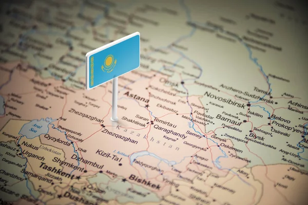 Cazaquistão marcado com uma bandeira no mapa — Fotografia de Stock