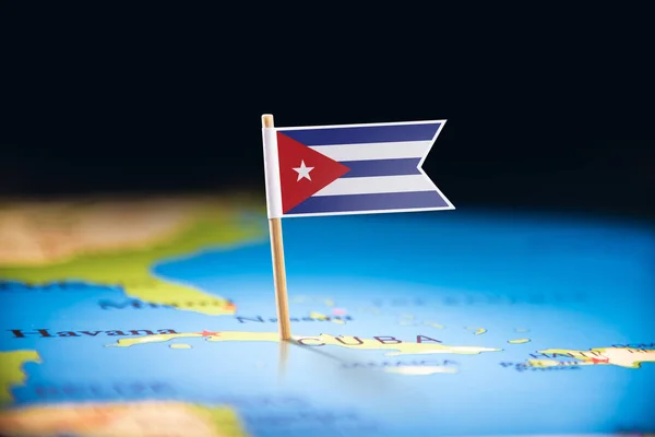 Kuba s vlajkou na mapě — Stock fotografie
