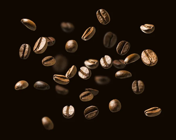 Granos de café en vuelo sobre un fondo oscuro — Foto de Stock