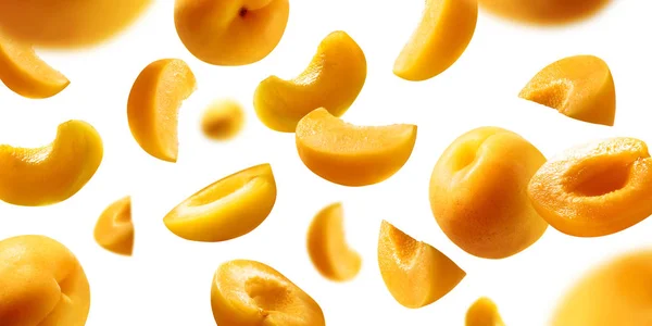 Apricots levitate on a white background. Ripe fruit in flight — Stock Photo, Image