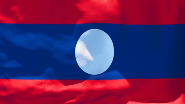 La bandera nacional de Laos ondea en el viento — Vídeos de Stock