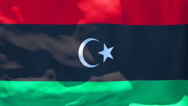 Libyens nationella flagga fladdrar i vinden — Stockvideo