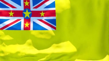 Niue 'nin ulusal bayrağı rüzgarda dalgalanıyor