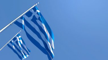 Yunanistan 'ın ulusal bayrağı mavi gökyüzüne karşı rüzgarda dalgalanıyor