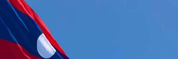 Representación 3D de la bandera nacional de Laos ondeando en el viento — Foto de Stock