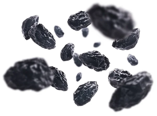 Dried prunes levitate on a white background — Stock Photo, Image