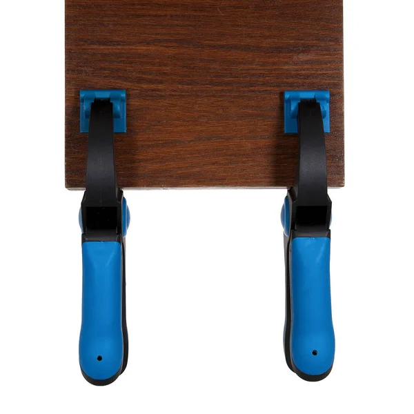 ラチェット ロック バネ式留め具は 白の背景に木の棒を保持します クランプを使用して 保持するか木工の木をキャッチ — ストック写真