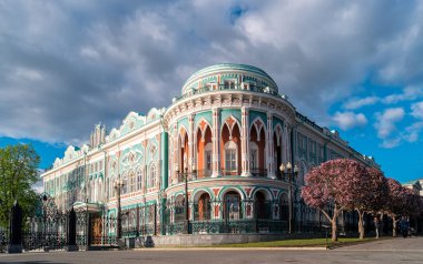 Ekaterinburg, Russia - June 7, 2018: House of Sevastyanov is one of the symbol of the town at World Cup 2018 near the city pond. clipart