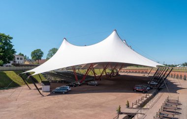 Hamina, Finland - June 20, 2019: A concert venue with a tent on the territory of the old bastion. clipart