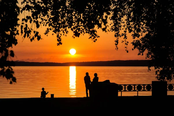 Silhouette of a couple in love at sunset or sunrise