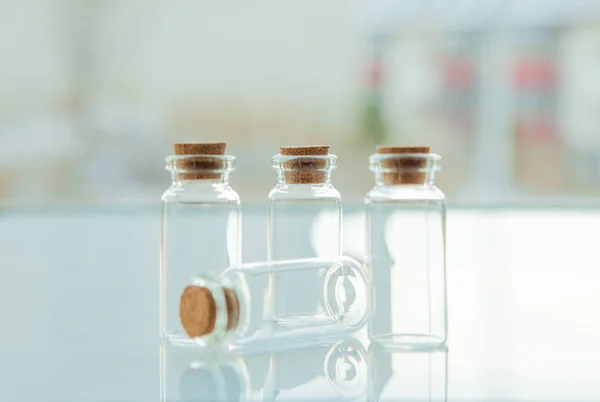 Empty little bottles with cork stopper, close-up