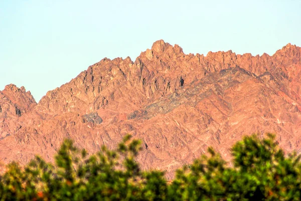 Panoramic view at hills red mountain lighted by sunrise light