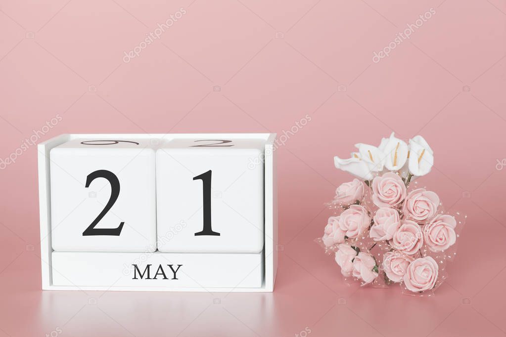 May 21st. Day 21 of month. Calendar cube on modern pink background, concept of bussines and an importent event.