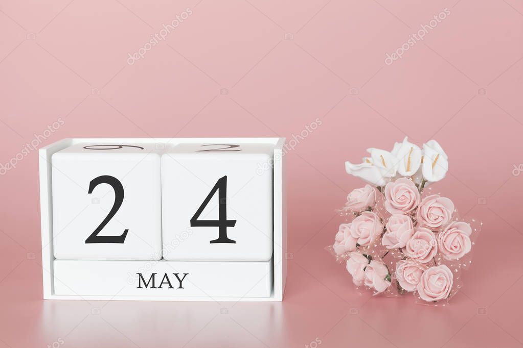 May 24th. Day 24 of month. Calendar cube on modern pink background, concept of bussines and an importent event.