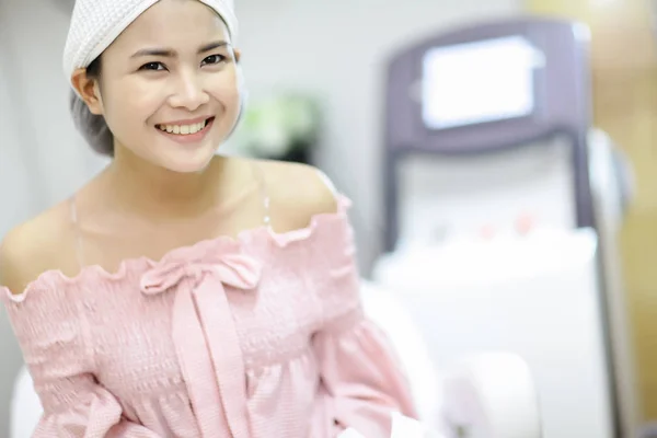 Laser Machine.Young woman receiving laser treatment.Skin Care.Young Woman Receiving Facial Beauty Treatment, Removing Pigmentation At Cosmetic Clinic. IPL. Photo Facial Therapy.Anti-aging Procedures.
