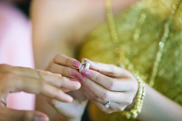 Bride show wedding ring on hand before give to groom in wedding ceremony. image for background, copy space and objects. Will you marry me concept.