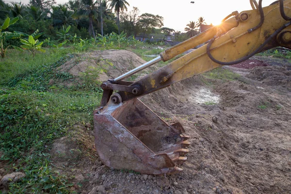 Building Machines: Digger loading trucks with soil. Excavator loading sand into a dump truck. Work in the quarry. Excavator Loading Dumper Truck at Construction Site.