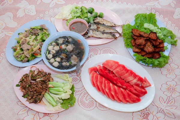 Tradition Northern Thai food. on a wooden table, Set of Thai food popular menu. radition lunch or dinner.Thai food concept Spicy Paste Dip Nam Prik Asian style banquet.Thai traditional Kantoke set.