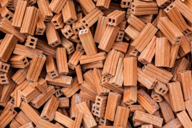 tuğla kare inşaat malzemeleri grubu. tuğla doku ve soyut arka plan veya metin doldurmak için kopya alanı için vinyet. Düzensiz kahverengi tuğla yığını.