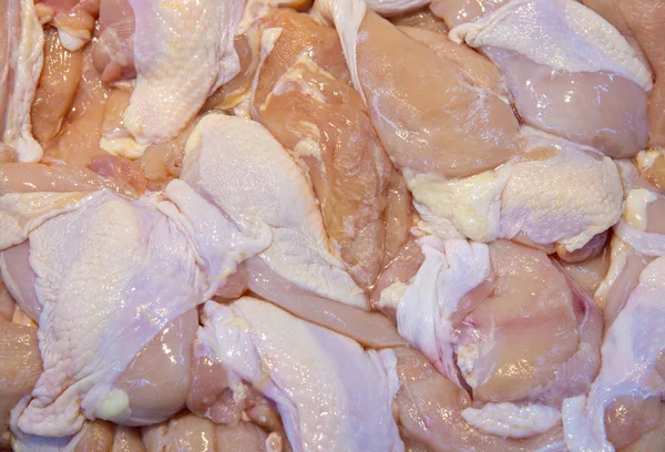 Pile of raw chicken pieces in the market For self-catering. Quality control in the market. Reduce the danger of food contamination by cooking yourself.