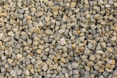 Taşların dokusu ve arkaplanı. Kaya dokusu. Ezilmiş çakıl zemini. Arkaplan için çakılların kusursuz dokusu. 