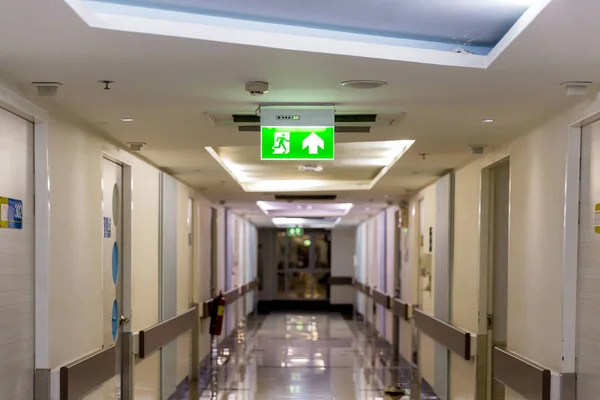 Green Emergency Exit Sign Showing Way Escape Fire Exit Building — Stock Photo, Image