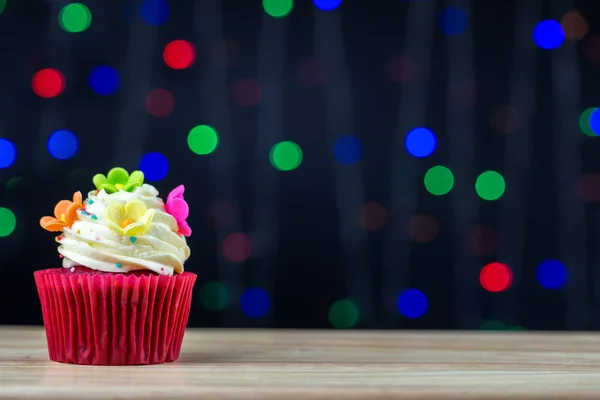 Birthday cupcake with a single blue candle.Cupcake with yellow cream and heart for love valentines.green crown cupcakes with cream cheese frosting and a Color Flower. Beautiful and delicious cupcake.