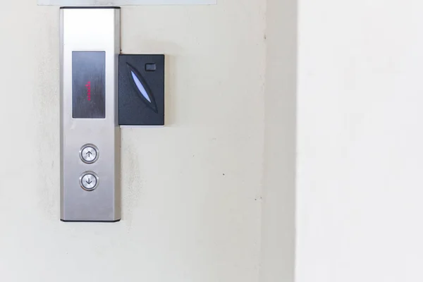 securing lift or elevator access control. elevator access control, Hand holding a key card to unlock elevator floor before up or down.