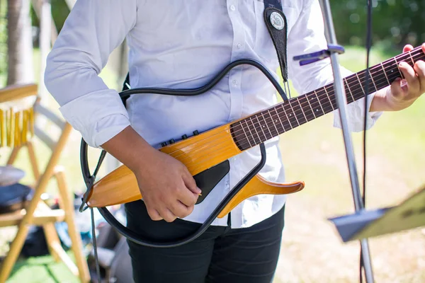 guitarist plays.chord on an electric guitar.Close up of an electric guitar being played.