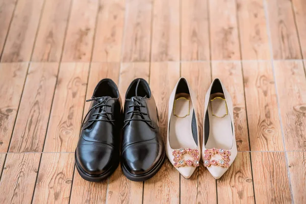 Bride\'s and groom\'s shoes. Bride And Groom\'s Shoes Side By Side. Bride and groom accessories.