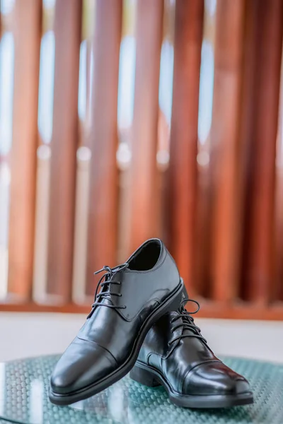 Groom black elegant shoes. Male elegance dress shoes. Wedding groom leather black lacquered shoes. Wedding concept.