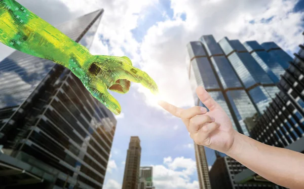 human and robot hands reaching to each other. Robot hand making contact with human hand on  background. Hand of man pretending to touch an invisible screen against blur view of city.