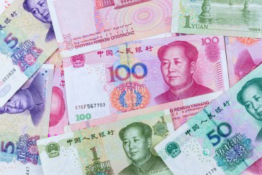 birçok tip çin banknotlar, yuan para yığını. dünya ekonomisini etkileyen para birimidir. para oyunu güçleri. ekonomi ve fon kavramı.