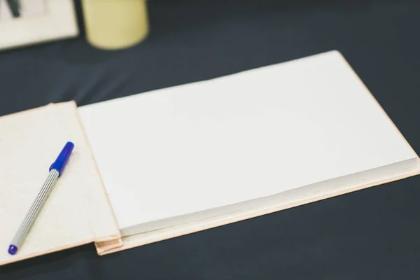 Wedding album, blank page, guest list, to do list.still life photography concept by memory and notebook.Notepad book.Notebook and asters on canvas background.soft and blur style for background.