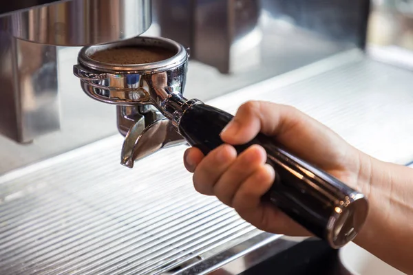 Coffee extraction from professional coffee machine. coffee machine preparing fresh coffee and pouring into cups at restaurant, bar or pub. Espresso shot from machine.