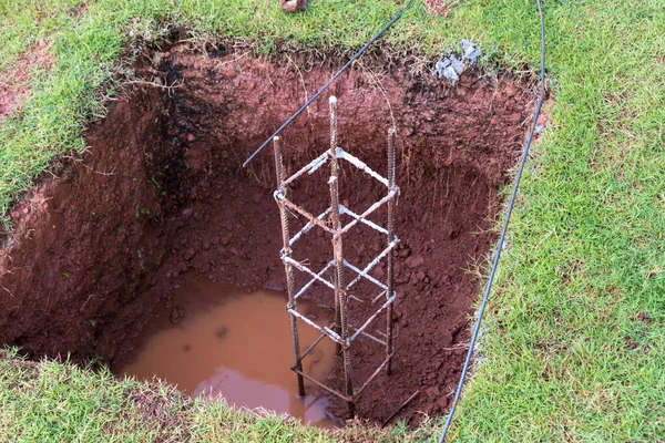 Pile foundation of building at construction site. steel rebar of concrete piles, foundation slab. Pile cap reinforcement work.Foundation structural work at construction site.