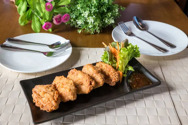 Fried Chicken Wings. Fried chicken wings with fish sauce is a popular menu in Thai restaurants.