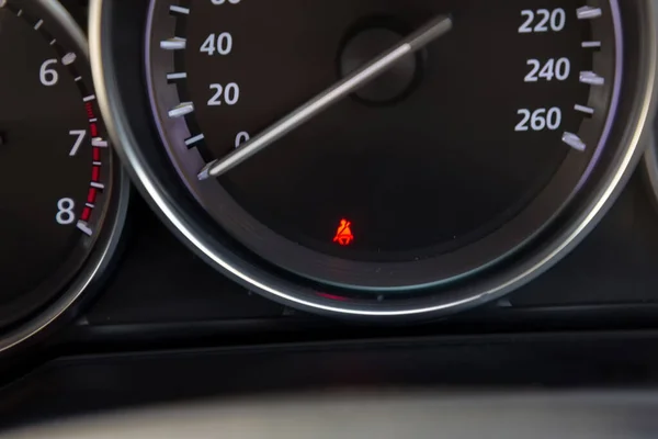 Seat belt icon on car dashboard. The symbol on the dashboard of the car: the non-fastened seat belt.  Seat belt icon on the dashboard of a car