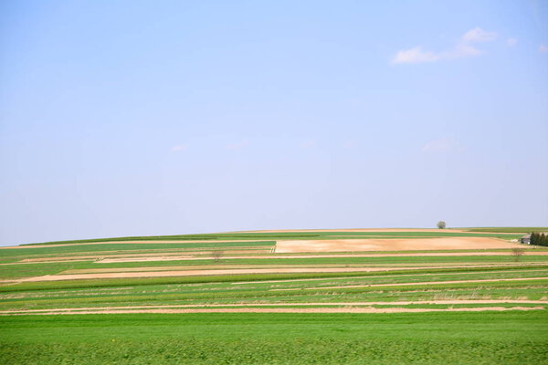 Springtime view of extensive farmland in the countryside.