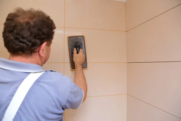 Man Repairing Wall Tiles Using Gypsum Board — Stock Photo, Image