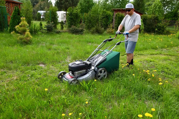 Man Cuts Lawn Combustion Mower Backyard Garden — Stock Photo, Image