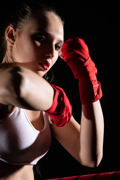 Combination of elbow punches in a sport called MMA for short. Professional player of mixed martial art. Strong woman.