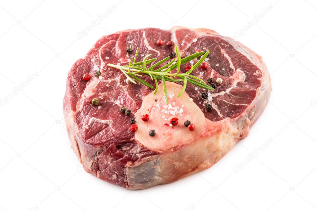 Raw beef shank with salt pepper and rosemary isolated on white background.