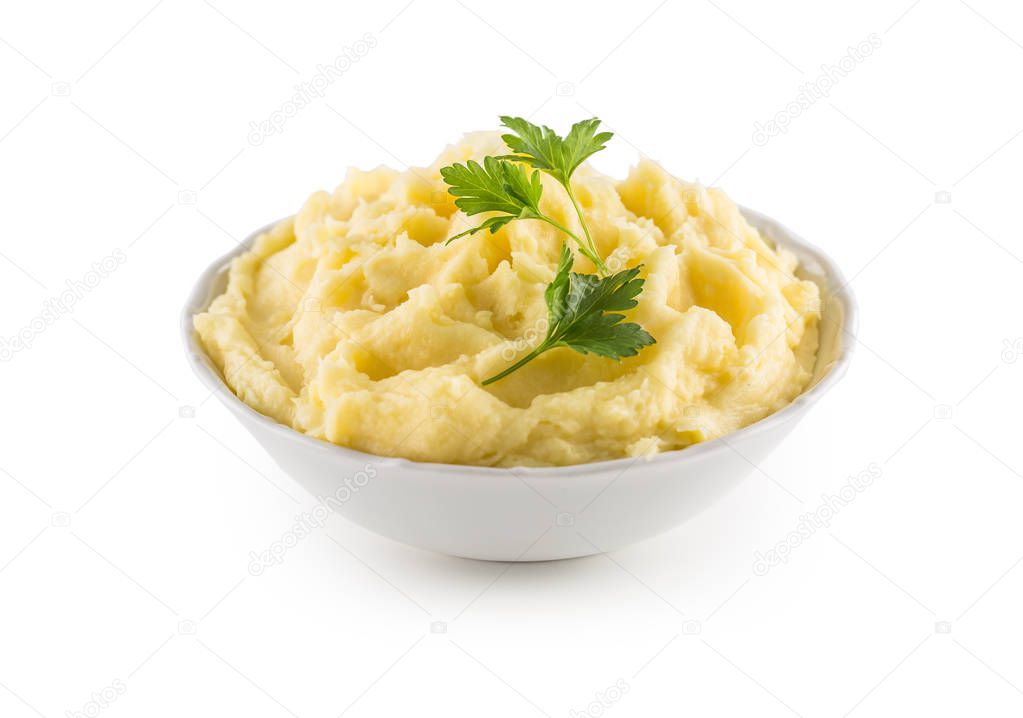 Mashed potatoes in bowl isolated on white background.