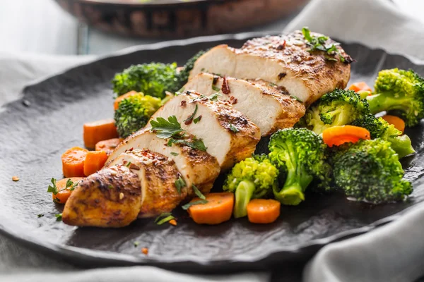 Roasted chicken breast with broccoli carrot and sesame.