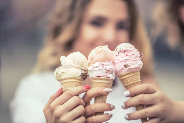 Delicious three ice cream in female hands - close-up. — Stock Photo, Image